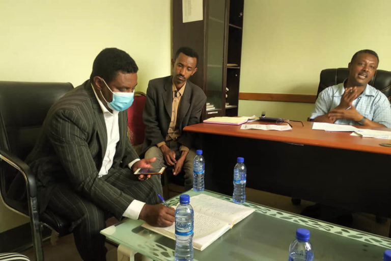 Axumite Abreha signing agreement for project